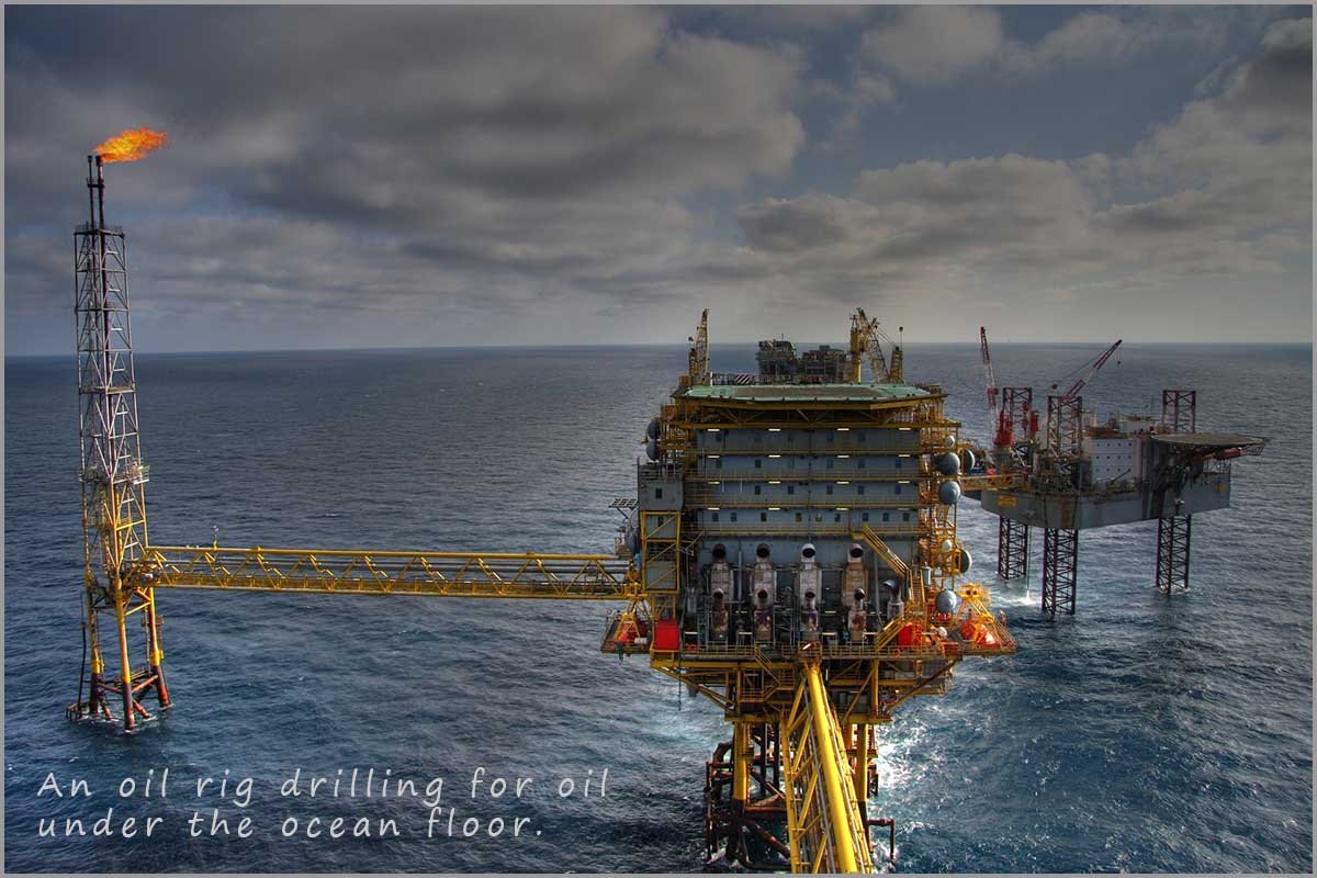 Image of an oil rig drilling for oil in the ocean.